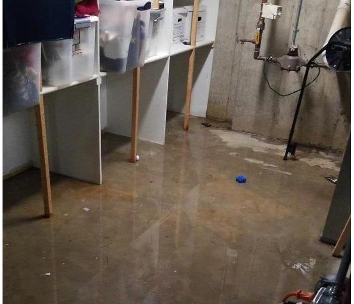 Photo of a basement with water on the floor
