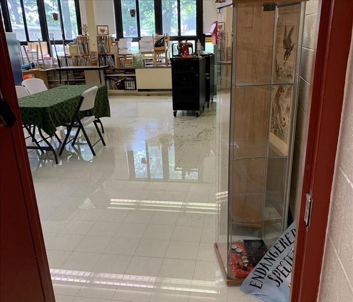 Classroom with water pooled on the floors